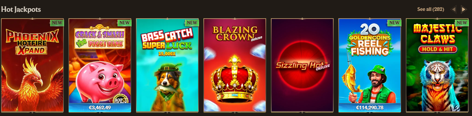 Hot jackpots section showcasing popular slot titles like Phoenix Hotfire Xpand, Crack & Smash Piggy Bank, Bass Catch Super Luck, Blazing Crown, Sizzling Hot Deluxe, 20 Golden Coins Reel Fishing, and Majestic Claws with “NEW” tags and jackpot values.